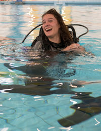 Happy woman in swimming pool