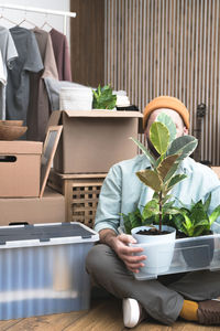 Adult man moving in new unfurnished apartments