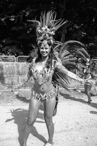 Full length of smiling young woman