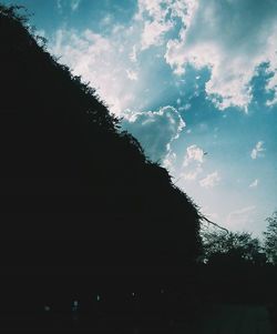 Low angle view of building against cloudy sky