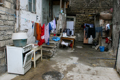 Clothes drying against wall in old building