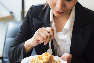 Close-up of woman having food
