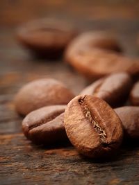 Close-up of roasted coffee beans on table