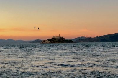 Scenic view of sea against sky during sunset