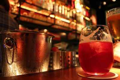 Close-up of beer in glass on counter at bar