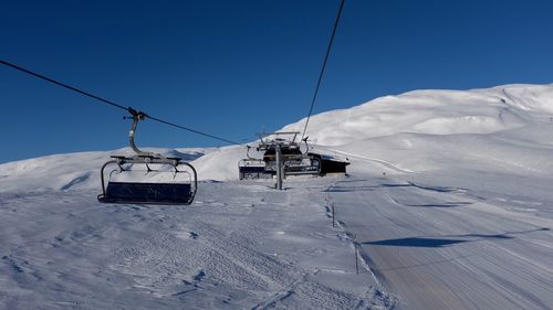 Overhead cable car on snow covered landscape