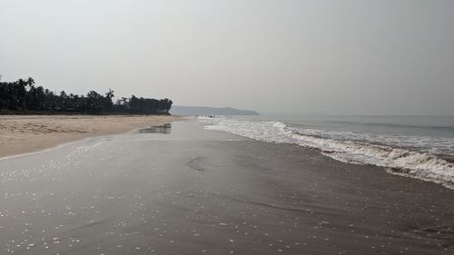 Scenic view of beach against clear sky