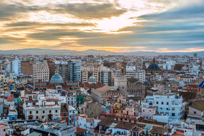 High angle shot of townscape against sky at sunset