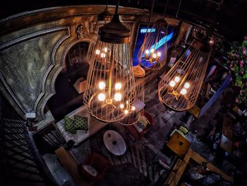 High angle view of illuminated lighting equipment on table