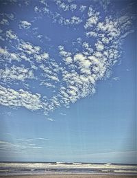 Scenic view of sea against blue sky