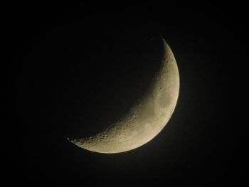 Low angle view of moon against sky at night