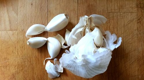 High angle view of white garlic on table