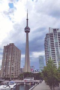 Skyscrapers against cloudy sky