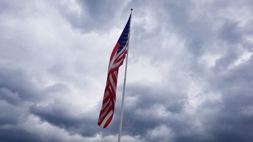 Low angle view of flag against sky