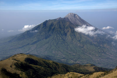 Scenic view of volcanic mountain against sky