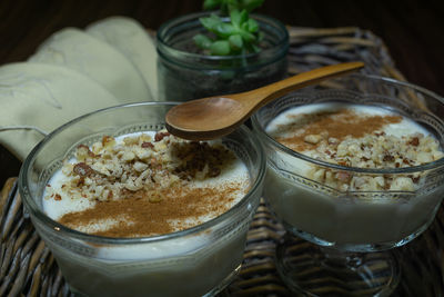 Rice pudding served in glass cups. homemade dessert in a wicker tray.