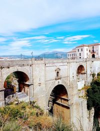 Arch bridge by building against sky