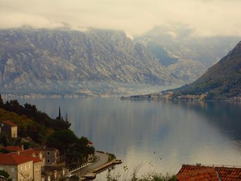 Scenic view of lake and mountains against sky