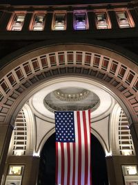 Low angle view of illuminated flags