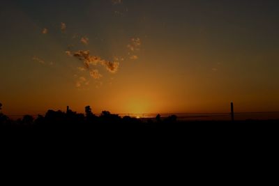 Scenic view of silhouette landscape against sky during sunset