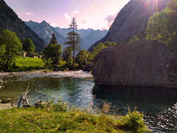 Scenic view of lake and mountains against sky