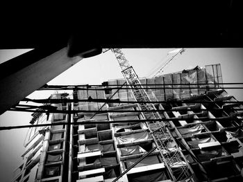 Low angle view of construction site against sky