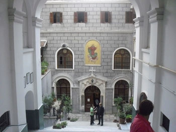 Low angle view of people walking in tunnel