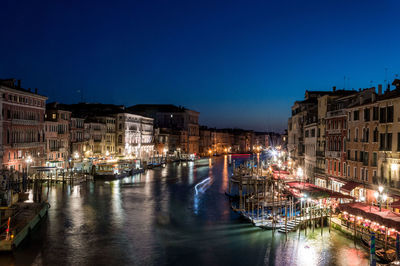 High angle view of illuminated grand canal against sky at night