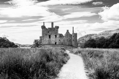 Narrow pathway leading towards castle