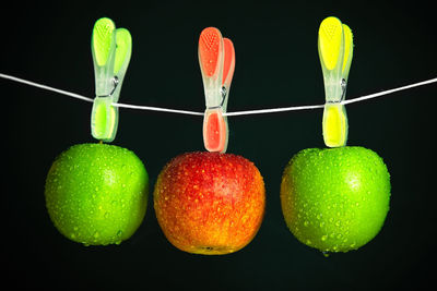 Close-up of fruits against black background