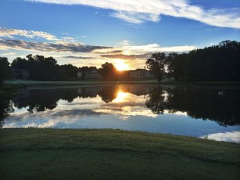 Scenic view of lake at sunset