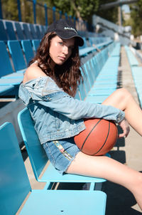 Young woman playing basketball