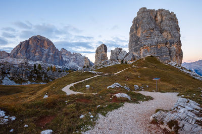 Rock formations on landscape against sky