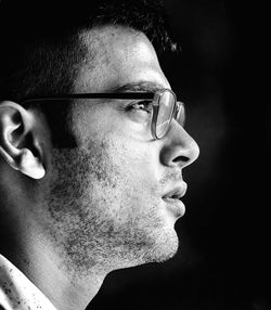 Close-up portrait of young man looking away