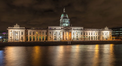 Reflection of building in water at night