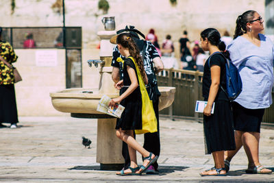 People walking on street in city