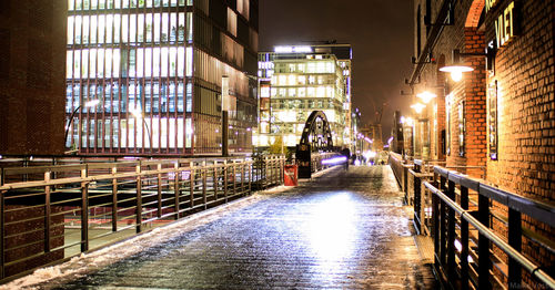 Man in illuminated city at night