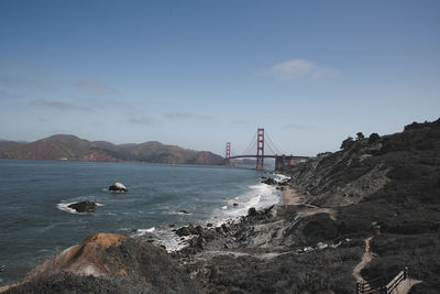 View of suspension bridge over sea