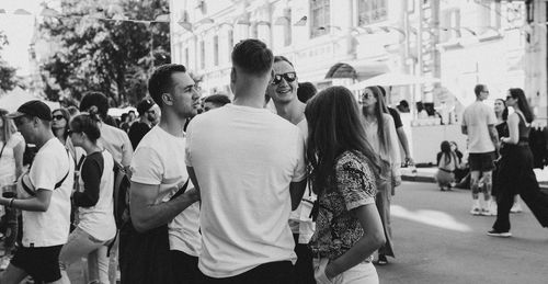 People standing on street in city