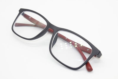High angle view of eyeglasses on white background
