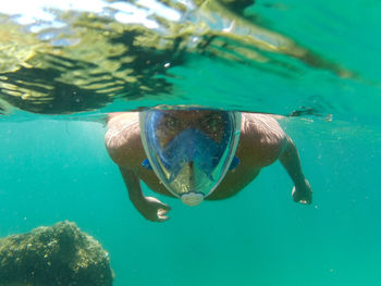 View of man swimming in sea