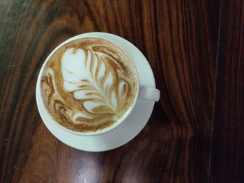 Close-up of cappuccino on table
