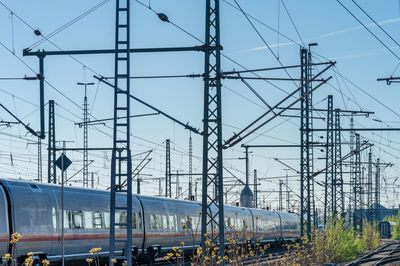 Train on railroad track against sky