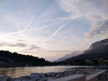 Scenic view of lake against sky during sunset