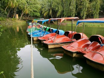 Boats moored in lake