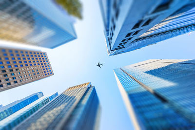 Low angle view of buildings in city against sky