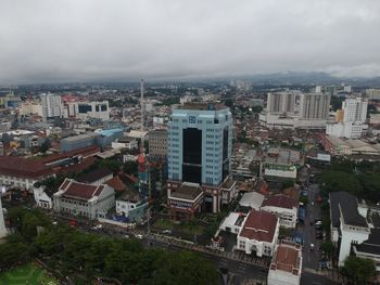 High angle view of buildings in city against sky