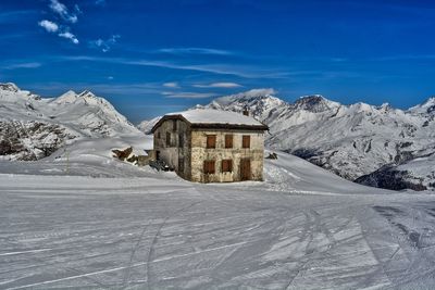 Zermatt scenic view of snowcapped mountains against blue sky