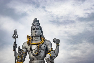 Low angle view of statue against sky