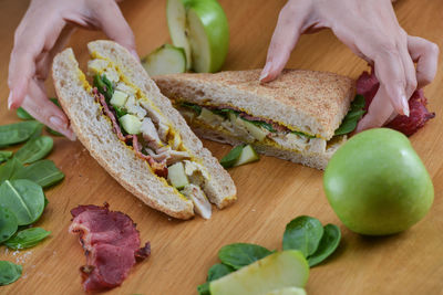 Close up of woman's hands with vegetables